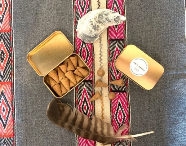 15 palo santo incense cones with rose gold tin container. Andean colorful cloth. Feather and shell